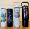 HeyZoos, Uzi Jesus Tumbler | Dungeon Crawler Carl | 20oz or 30oz Rainbow Engraved Cup | Black or White
